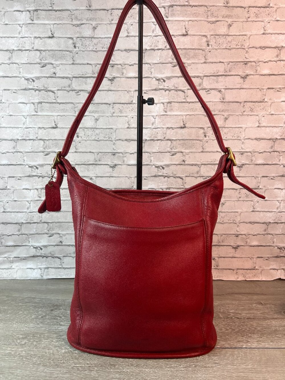 Red Coach 9060 is a vintage "Slim Duffle Sac" Coach Legacy collection
